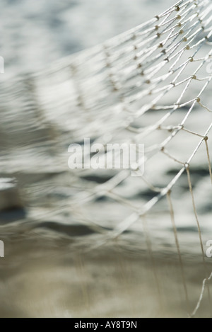 Fishing net over water, close-up