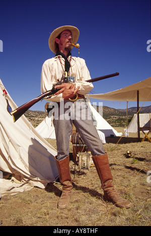 MR 571 Mountain man Paul Wenzel stands guard over the camp, at 'Miner's Day' in the ghost town of White Oaks, New Mexico. Stock Photo