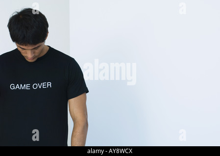 Man wearing tee-shirt printed with the words 'game over' Stock Photo