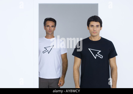 Two men wearing tee-shirts printed with computer cursors Stock Photo