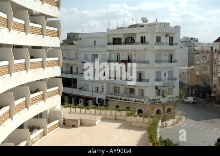 El Hana Residence Hotel (left) and street in Sousse city in Tunisia Stock Photo