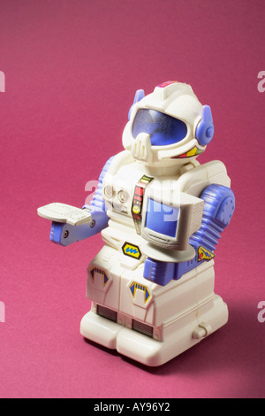 Toy Robot with Miniature Computer Stock Photo