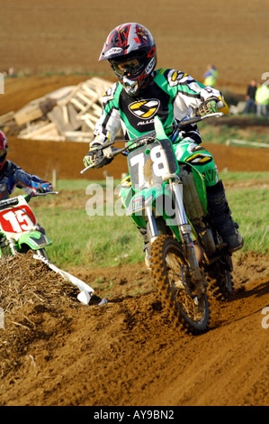 a guy rider on a motocross bile motorcycle jumping and racing big air Stock Photo