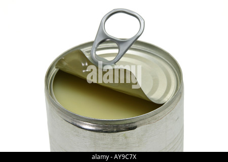 Close up of an opened can of condensed milk on white background Stock Photo