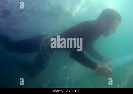 Joss Ash underwater duck diving, Chapel Porth, Cornwall, UK Stock Photo