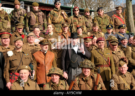 large WW2 reenactment  group prepare for photograph  Crich forties weekend Peak District Derbyshire England UK Stock Photo