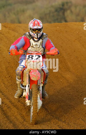 a guy rider on a motocross bile motorcycle jumping and racing big air Stock Photo