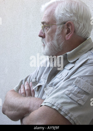 Man leaning against a wall Stock Photo