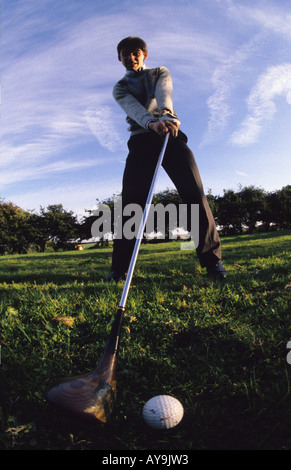 golfer lining up shot using driver uk Stock Photo