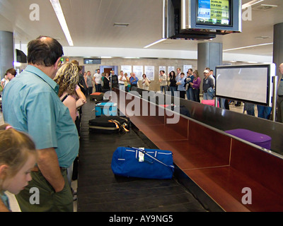 Airline passengers collecting their luggage in the baggage hall of the Fuerteventura (Canary Islands) airport Stock Photo