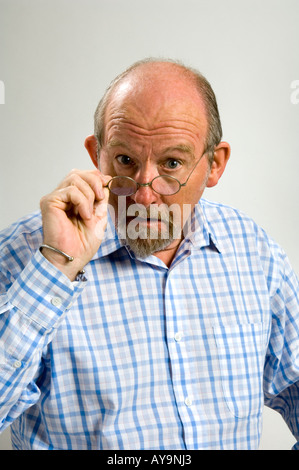 60 year old white man with a a goatee beard and a  facial expression depicting major surprise Stock Photo