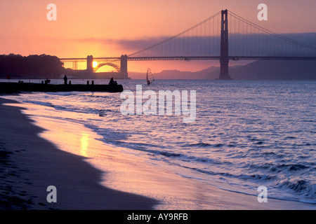 sun reflecting on the sandy beach at Crissy Fields along the San Francisco Bay near the Golden Gate Bridge in California Stock Photo