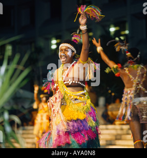 Female dancer of Raun Raun Theatre Group from Papua New Guinea wears colourful dress at the Festival of Pacific Arts Stock Photo