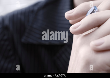 Close Up Of Business Woman In Striped Suit Wearing Blue Aquamarine Stock Photo