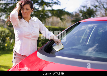 Woman with parking ticket Stock Photo