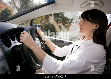 Woman using hands free phone in car Stock Photo