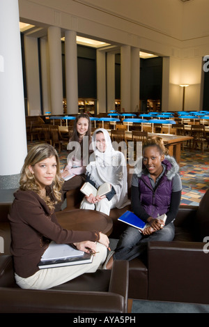 Portrait of four women students in a sitting lounge in a library Stock Photo