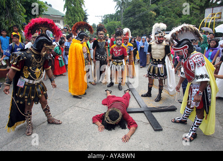 Philippines, easter procession at Moriones Festival on Good Friday. Jesus bearing the cross in the Way of the Cross procession Stock Photo