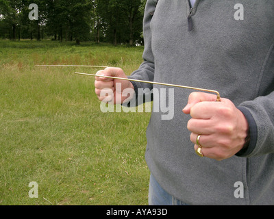 Dowsing rods Divining rods dowsing dowser dowse energy energy lines water minerals hold new age water witching hands Stock Photo