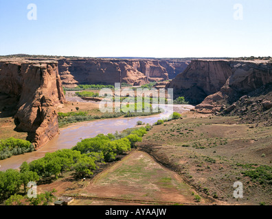 A view of the eroded riverbed and sandstone canyon walls of Canyon de Chelly Stock Photo