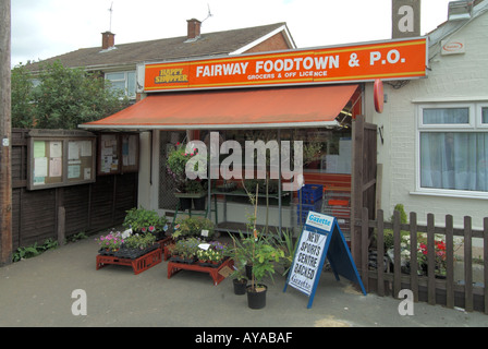 Village store local post office parish council notice board & Happy Shopper brand sign bedding plants for sale live in cottage Doddinghurst Essex UK Stock Photo