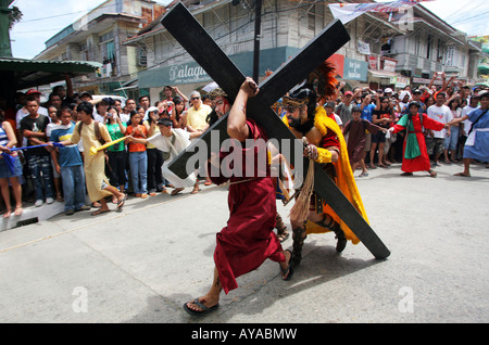 Philippines, easter procession at Moriones Festival on Good Friday. Jesus bearing the cross in the Way of the Cross procession Stock Photo