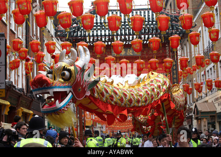 London's Chinatown dragon welcomes the Chinese Beijing Olympic torch making its way through 31 miles of the capital's streets Stock Photo