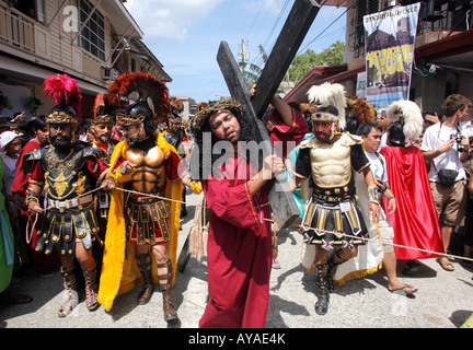 Philippines, easter procession at Moriones Festival on Good Friday. Jesus bearing the cross in the Way of the Cross procession Stock Photo