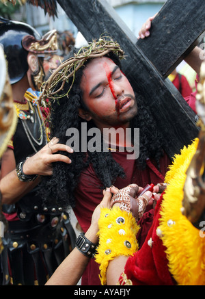 Philippines, easter procession at Moriones Festival on Good Friday. Jesus bearing the cross in the Way of the Cross procession Stock Photo