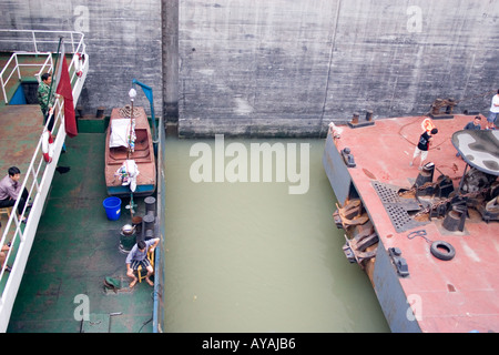 Barges and sailors waiting in a ship lock on the Yangtze River in China Stock Photo