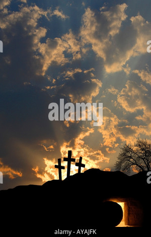 Empty tomb and three crosses Stock Photo