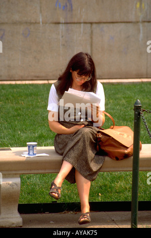 Student age 21 reading outside of Columbia University. New York New York USA Stock Photo