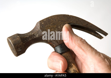 hand holding heavy hammer Stock Photo