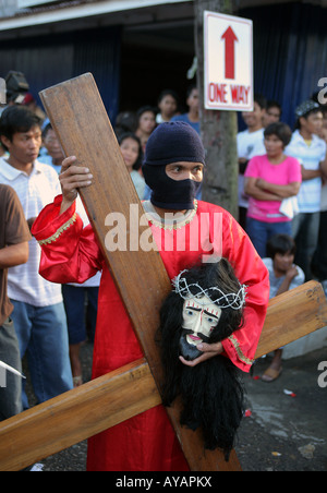 Philippines, easter procession at Moriones Festival on Good Friday. Jesus bearing the cross in the Way of the Cross procession Stock Photo