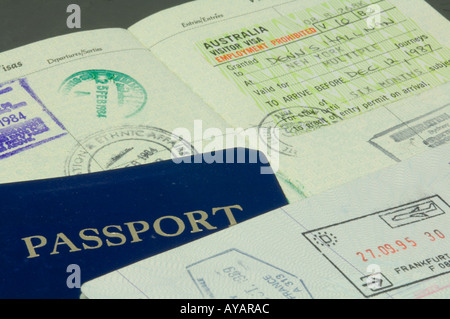 closeup of American passport showing customs stamps from Singapore and Australia Stock Photo