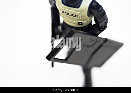 Toy Police figure made of plastic. Close up Stock Photo