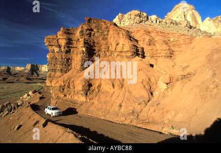 Fourwheeldrive vehicle on a dirtroad in Reds Canyon San Rafael Swell Stock Photo