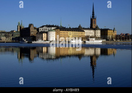 The spire of Riddarholmskyrkan church stands tall on the small island of Riddarholmen next to Gamla Stan in Stockholm, Sweden. Stock Photo