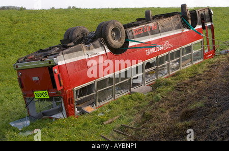 School bus in ditch Stock Photo