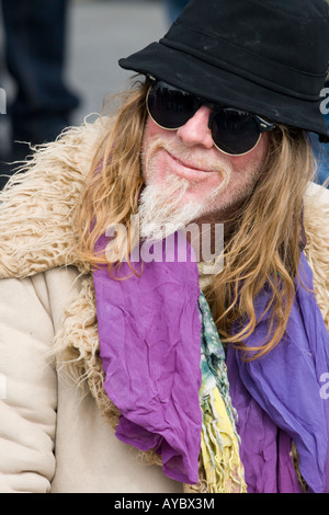 A man with long hair,black hat and sunglasses, Trafalgar Square, London, England Stock Photo