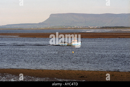 Fishing boat in Sligo Bay County Sligo Ireland with Ben Bulben in background Stock Photo