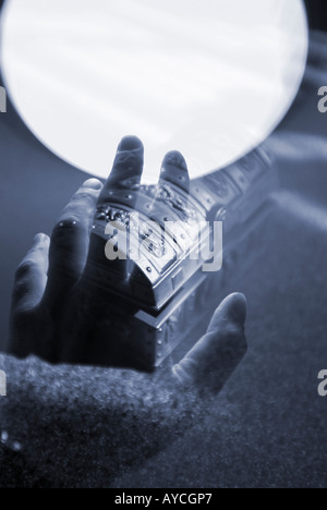 Hand Reaching for a treasure chest collage with light Stock Photo