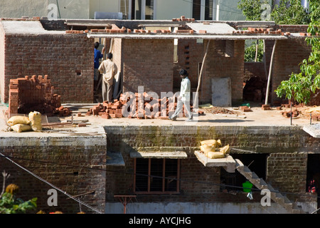 Builders on an Indian construction site building a new house Stock Photo