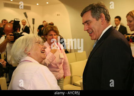 Prime Minister Gordon Brown MP chats to an attendee at a seminar in London Stock Photo