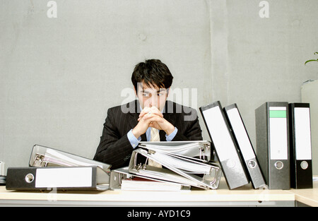 Businessman with messy desk Stock Photo