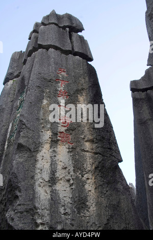 Chinese caligraphy carve on the stone formation at Shilin Stone Forest in Lunan Yi County about 120km from Kunming China Stock Photo