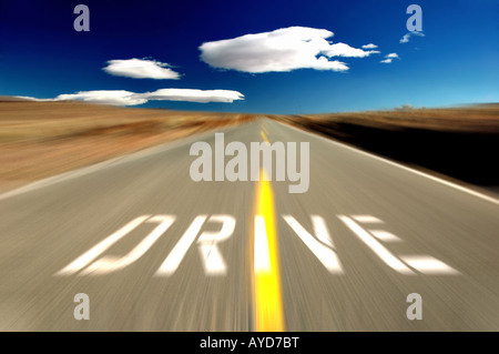 Drive sign on an empty high desert road with motion blur Eastern Sierra Mountains California Stock Photo