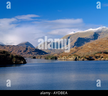 unspoiled tranquil calm lake surrounded by mountains in irelands scenic landscape Stock Photo