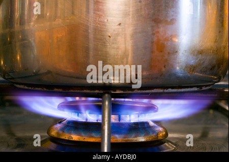 a pan on a gas stove, UK Stock Photo
