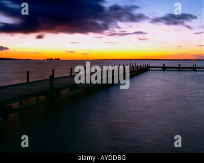 footbridge at the Steinhuder Meer dramatic sky sunset Stock Photo